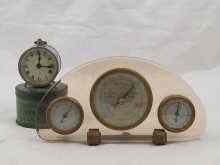 Appraisal: A combination barometer thermometer and hygrometer set in pink tinted