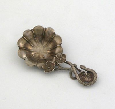 Appraisal: A Victorian floral caddy spoon the tendril stem with an