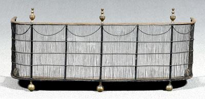 Appraisal: Wirework screen swag border below brass urn finials British or