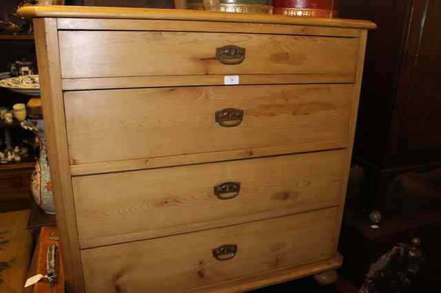 Appraisal: A STRIPPED AND WAXED PINE CHEST of four long graduated