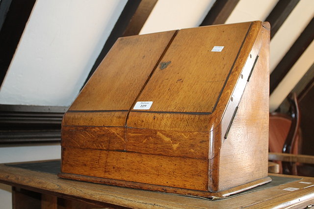 Appraisal: A VICTORIAN OAK FOLDING STATIONERY CABINET with calendar cm when