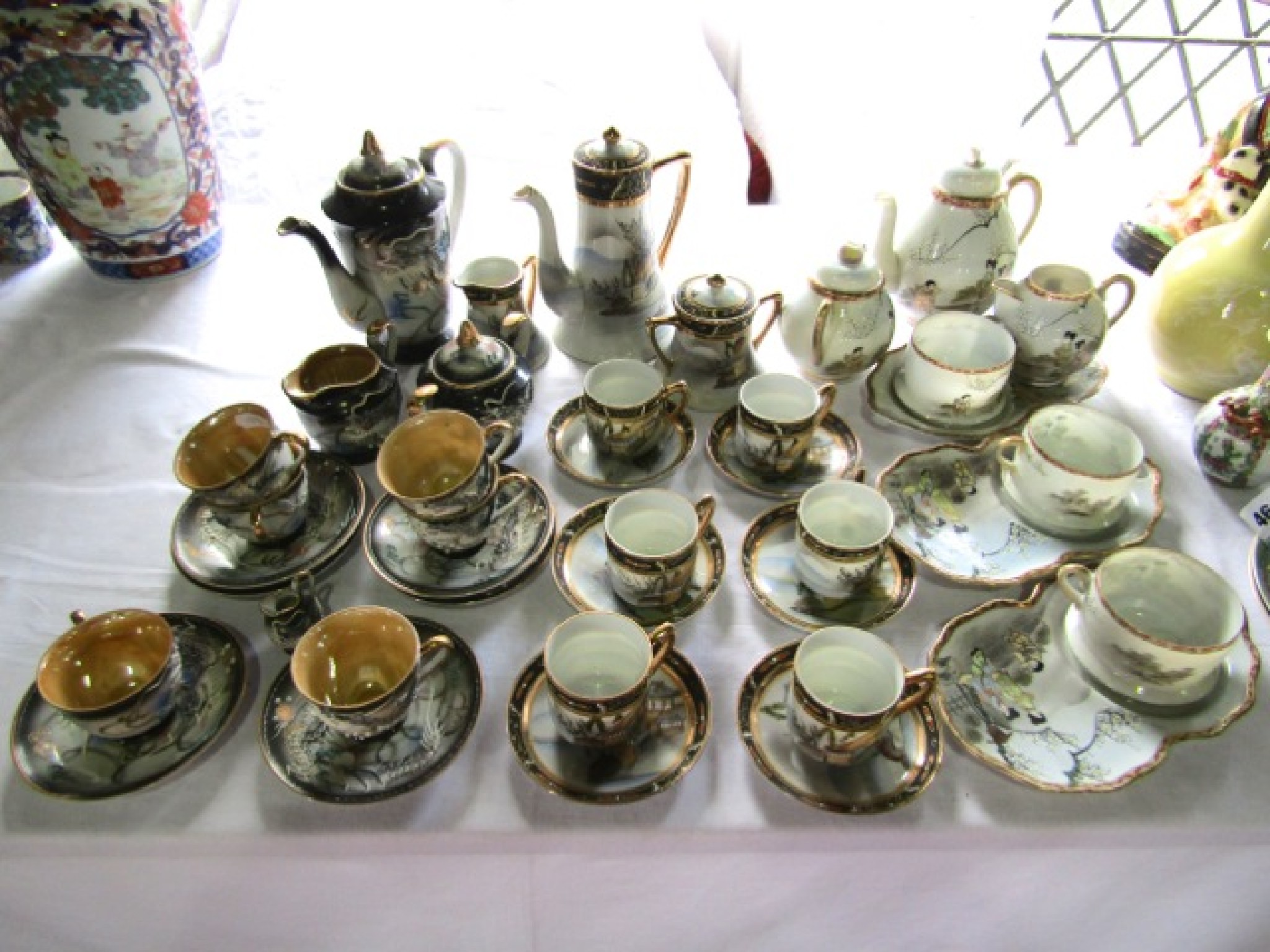 Appraisal: A collection of Japanese eggshell porcelain tea and coffee wares