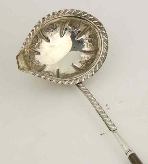 Appraisal: A William IV toddy ladle RH London with twisted whalebone