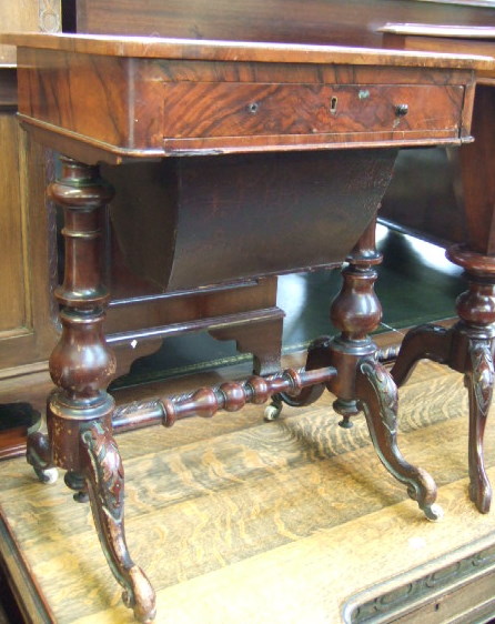 Appraisal: A Victorian walnut work table the rectangular top over fitted