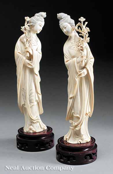 Appraisal: A Pair of Chinese Carved Ivory Figures of Maidens the