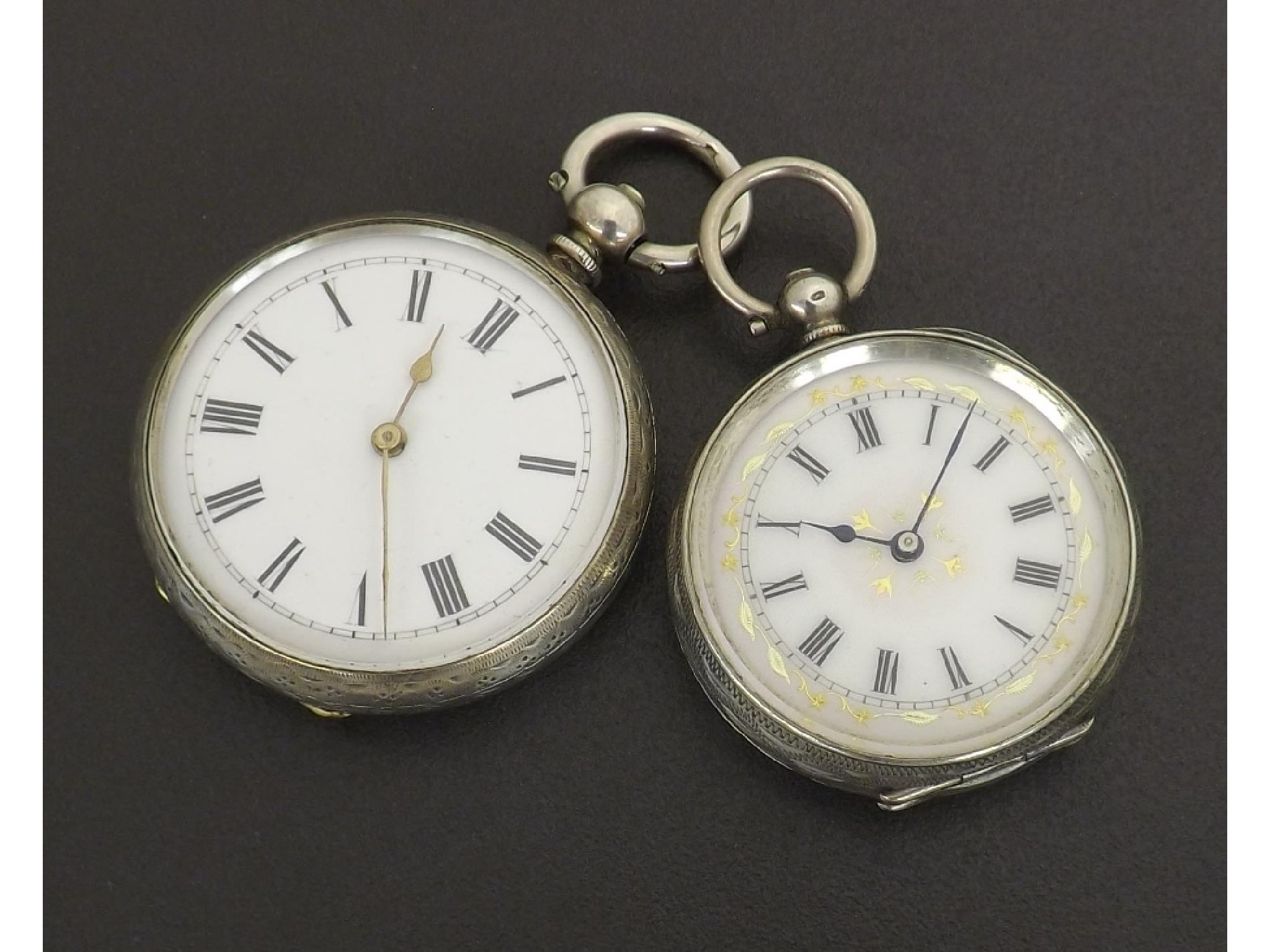 Appraisal: Two Swiss silver cylinder fob watches with engraved cases