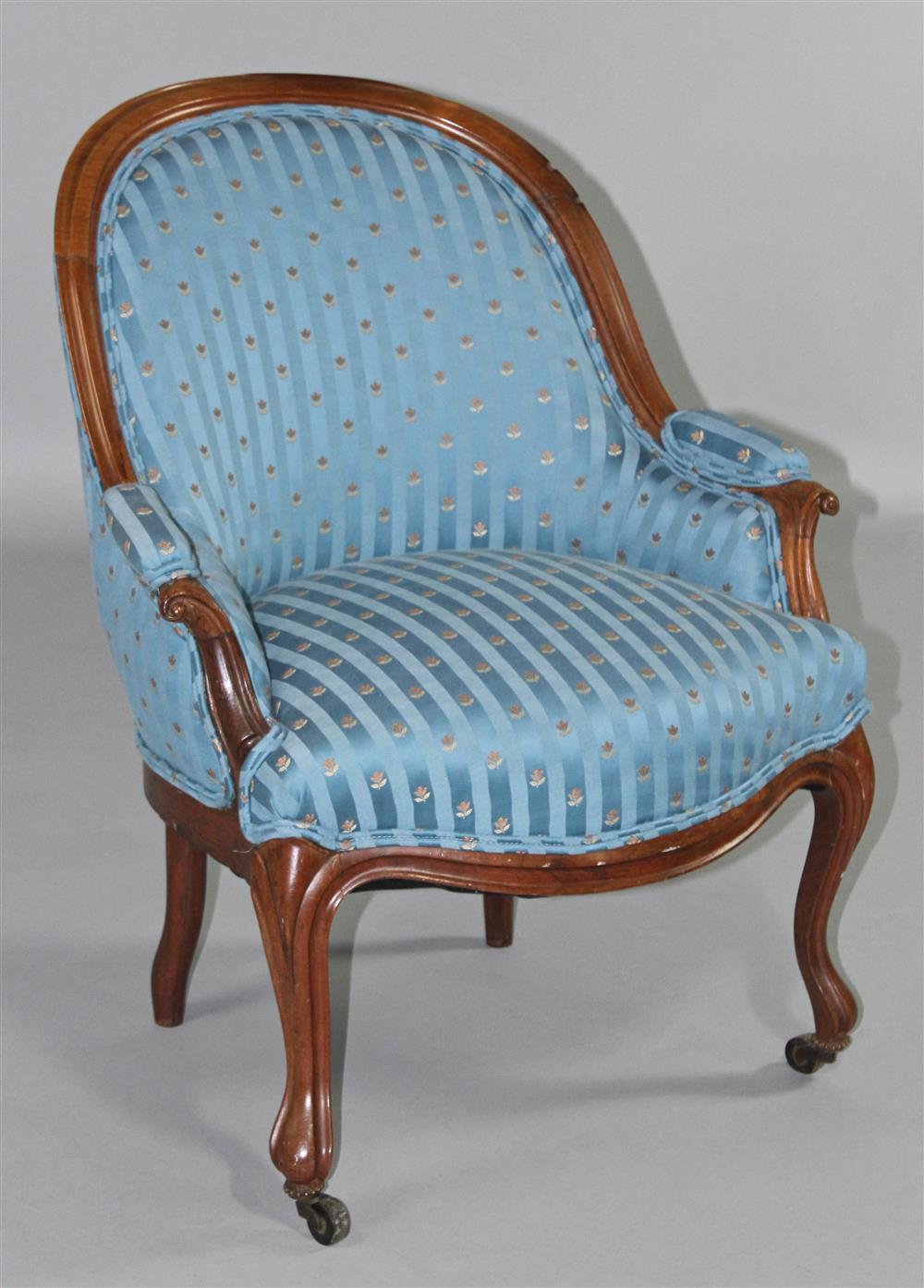 Appraisal: LOUIS XV STYLE WALNUT PETITE BERGERE EN CABRIOLE the enclosed