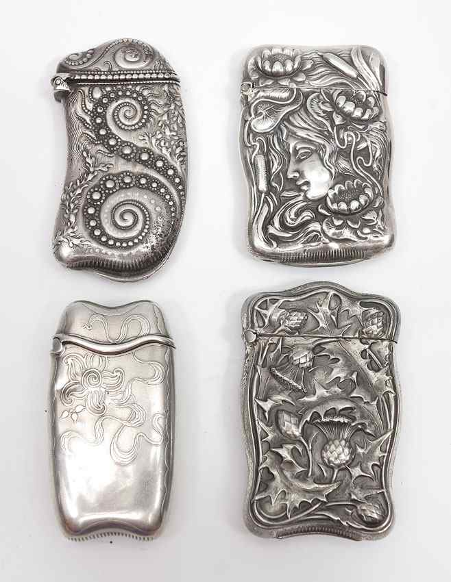 Appraisal: ART NOUVEAU STERLING SILVER MATCH SAFES To include Woman's left