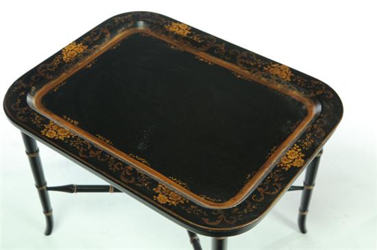 Appraisal: TOLE TRAY TABLE Twentieth century Tole-decorated tray on a bamboo-style