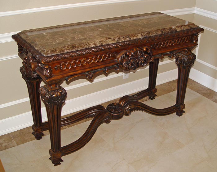 Appraisal: CONTEMPORARY CARVED FOYER TABLE Faux marble top over a table