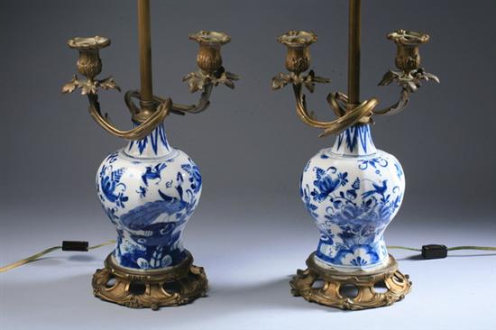 Appraisal: PAIR BRONZE-DOR MOUNTED DUTCH DELFT VASES th century Baluster-form avian