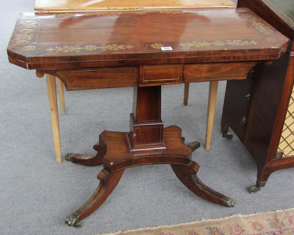 Appraisal: A Regency brass inlaid rosewood card table the canted rectangular