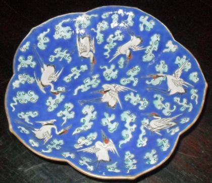 Appraisal: Polychromed enamel footed platelate qing dynasty