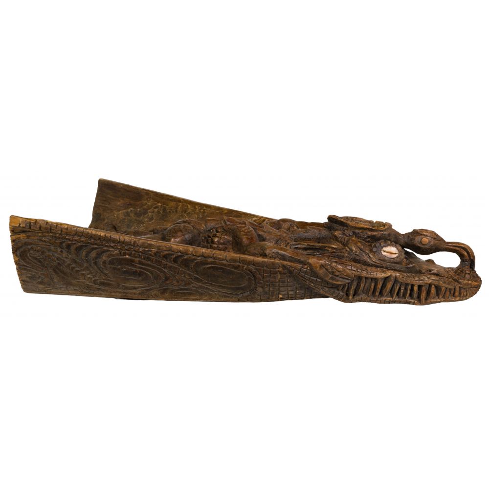 Appraisal: CROCODILE HEAD CANOE BOW FRAGMENTSepik region hand carved having shell