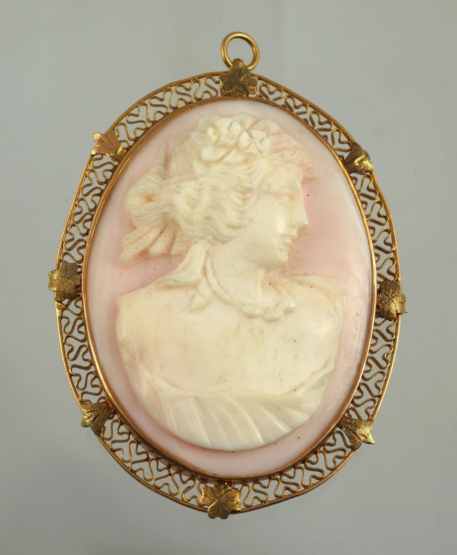 Appraisal: K YG oval carved pink shell cameo filigree frame h