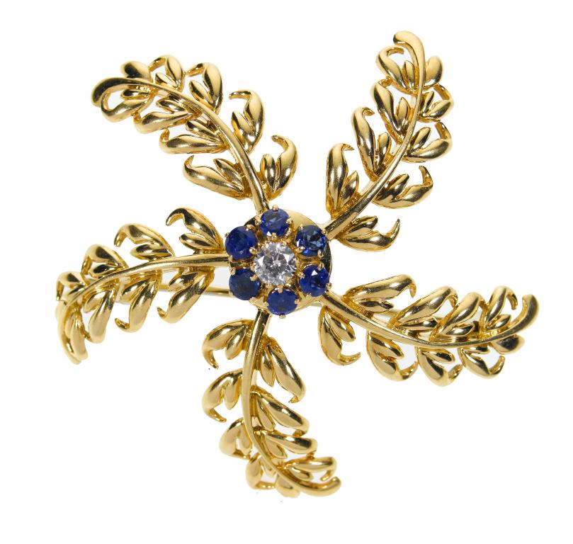 Appraisal: BOUCHERON A DIAMOND SAPPHIRE AND GOLD BROOCH the diamond-centred cluster