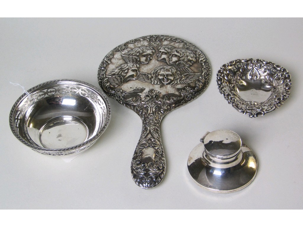 Appraisal: Lot comprising embossed silver hand mirror two silver bonbon dishes