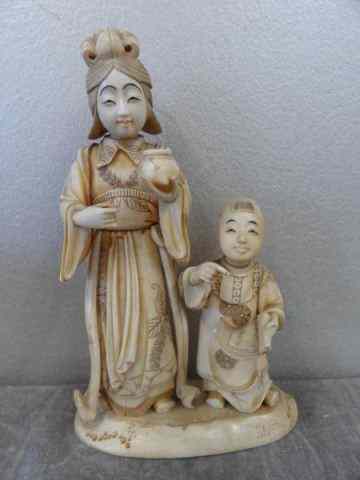 Appraisal: Asian Ivory of a Woman and Child The woman is