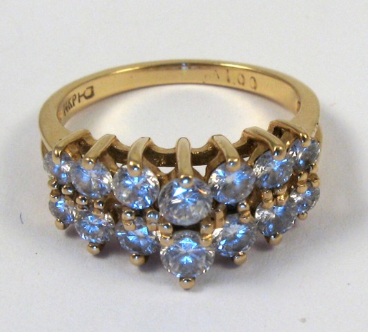 Appraisal: DIAMOND AND FOURTEEN KARAT GOLD RING set with round-cut diamonds