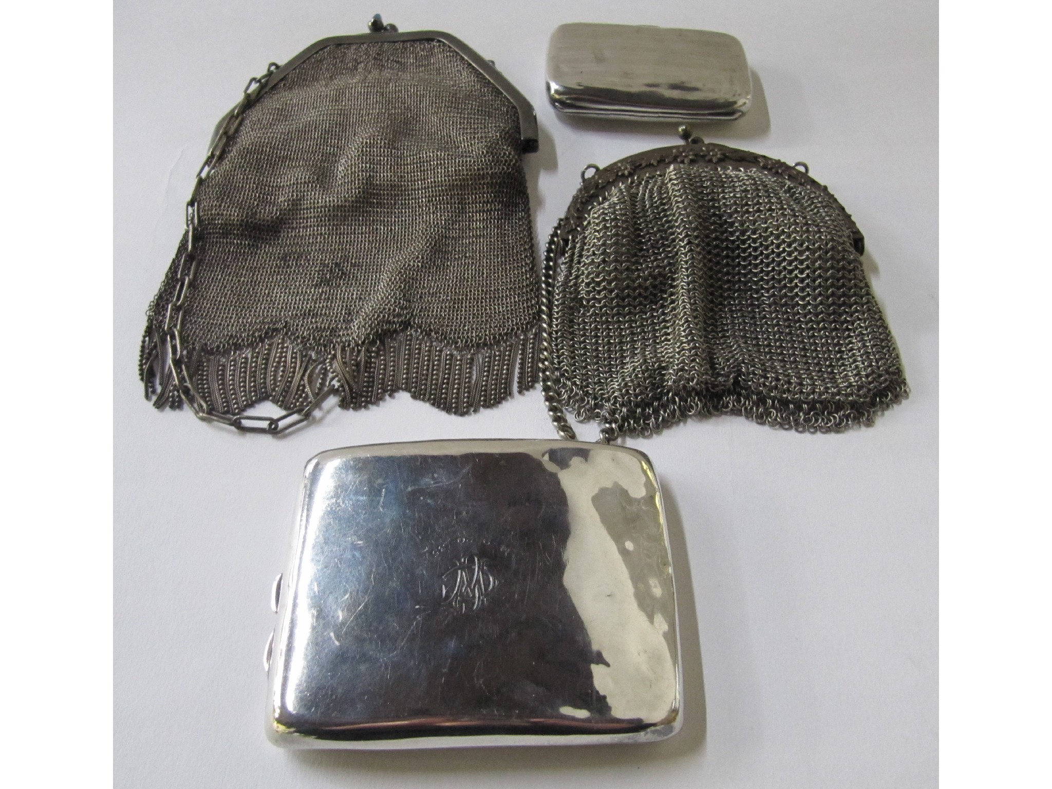 Appraisal: A lot comprising two silver cigarette cases and two metal