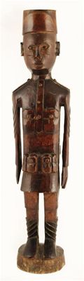 Appraisal: An East African carved wood figure of a soldier early