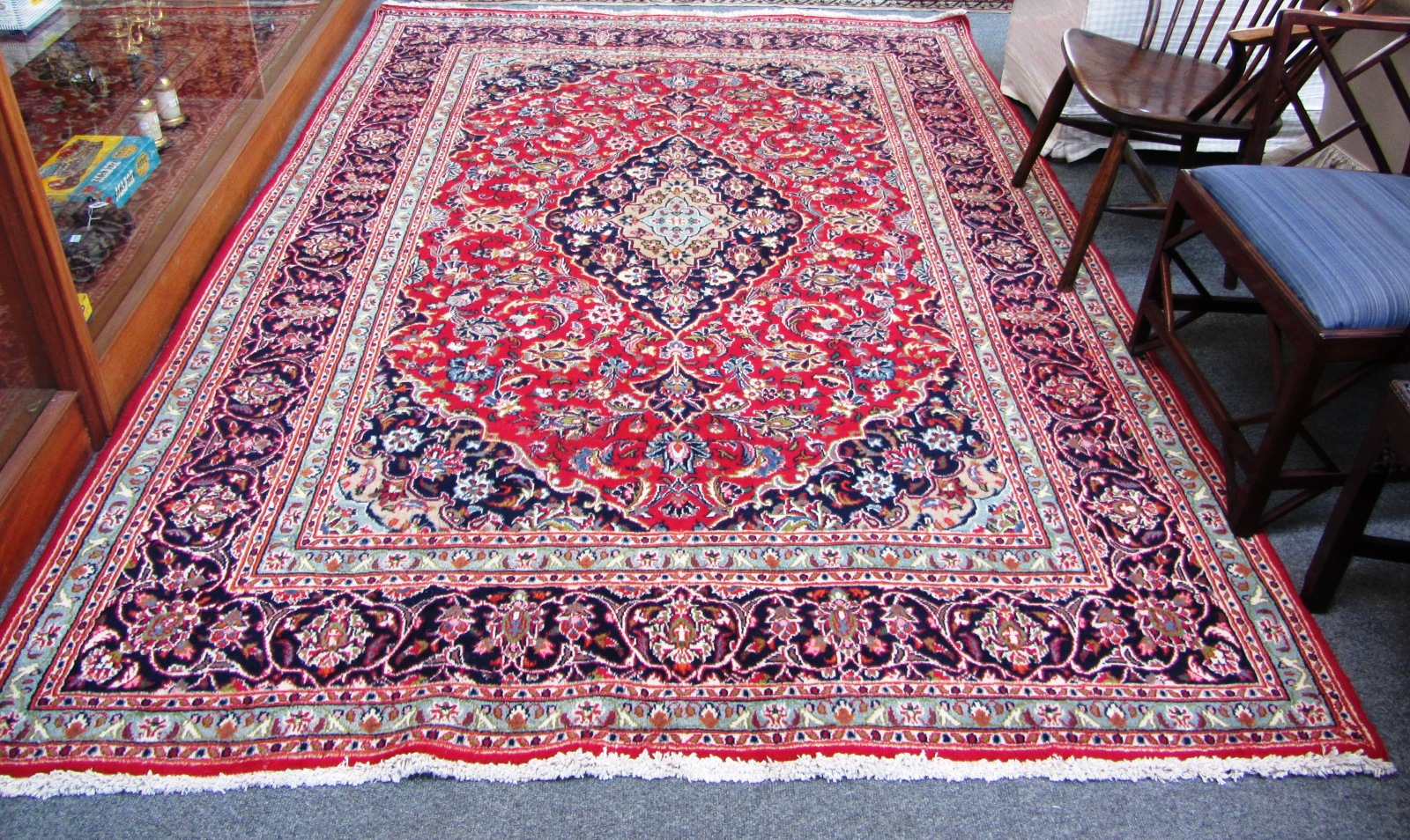 Appraisal: A North West Persian carpet modern the red field with