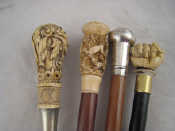 Appraisal: Four walking canes one with mahogany shaft