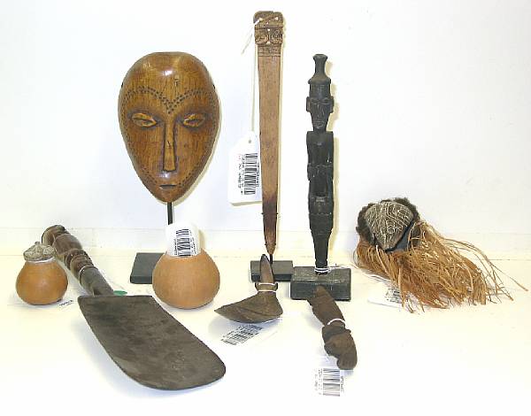 Appraisal: Nine ethnographic items Eight South Seas objects comprising a New