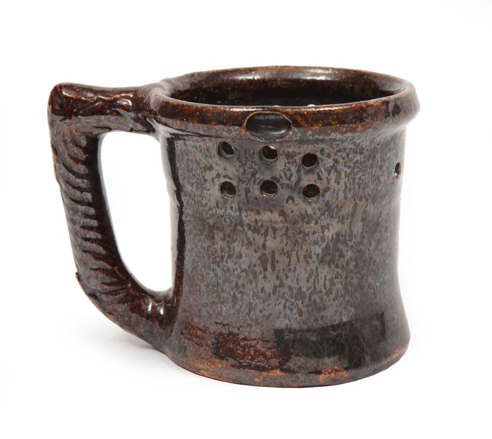 Appraisal: George Ohr Pottery Puzzle Mug c script signature mottled brown