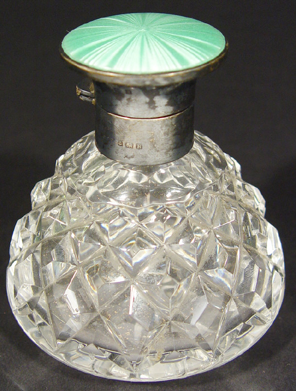 Appraisal: Silver mounted cut glass scent bottle with green enamelled hinged