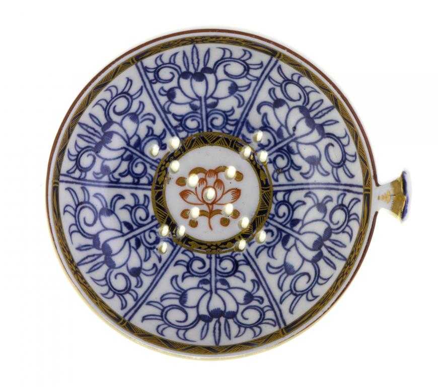 Appraisal: A FLIGHT EGG DRAINER with up-turned gilt handle painted in