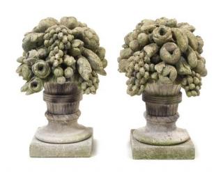 Appraisal: A Pair of Cast Stone Garden Models of Fruit-Filled Urns