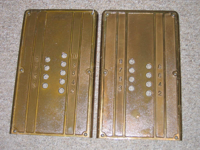 Appraisal: TWO CAST BRONZE ELEVATOR PLATES rectangular with rounded corners relief