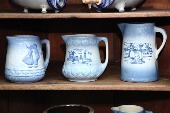 Appraisal: THREE BLUE AND WHITE STONEWARE PITCHERS White clay all of