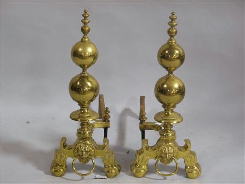 Appraisal: PAIR OF BRASS ANDIRONS With turned baluster standard above lion's