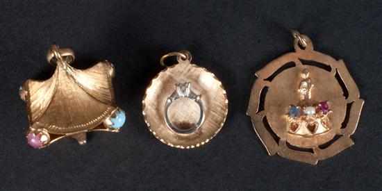 Appraisal: Three K gold and gemstone charms approximately grams total Estimate