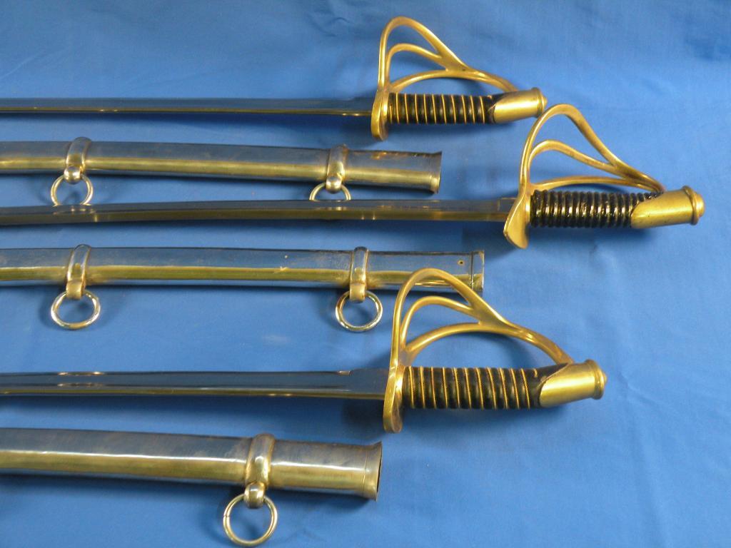 Appraisal: Three replica cavalry swords each with polished steel scabbard a