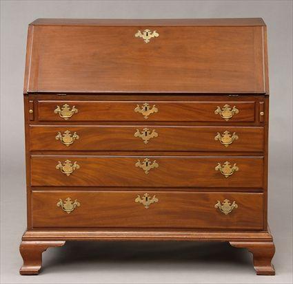 Appraisal: AMERICAN CHIPPENDALE CARVED MAHOGANY SLANT-FRONT DESK The flap opening to