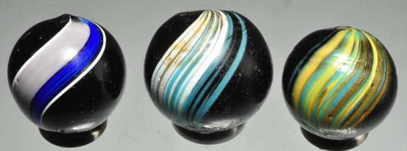 Appraisal: Lot of Indian Swirl Marbles Description One has a very