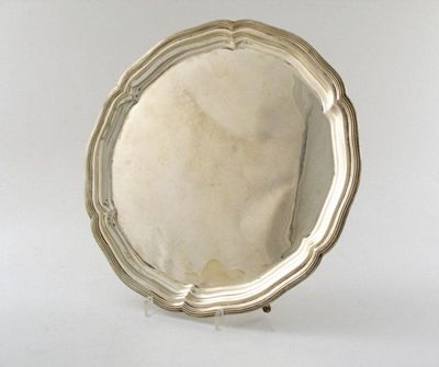 Appraisal: Two modern circular salvers shaped outline on three feet one