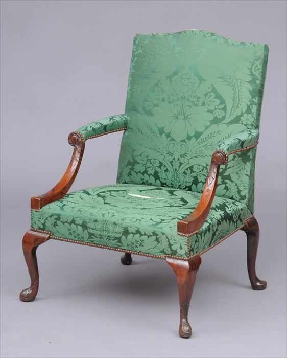 Appraisal: GEORGE II MAHOGANY LIBRARY ARMCHAIR The shaped cresting rail above