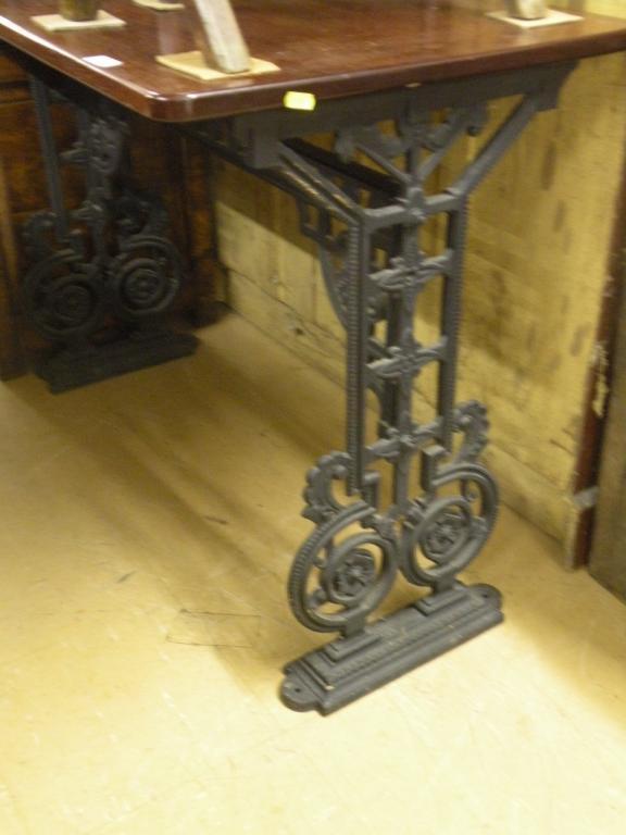 Appraisal: A Victorian cast iron and mahogany rectangular table