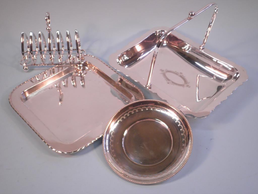 Appraisal: A silver plated toast rack a square dish a basket