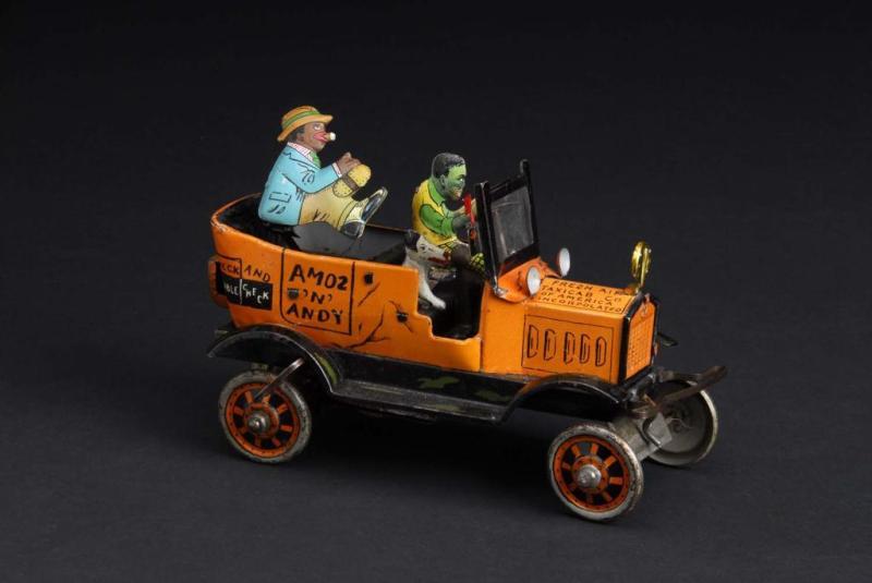 Appraisal: Tin Marx Amos 'N Andy Taxi Cab Wind-Up Toy Description