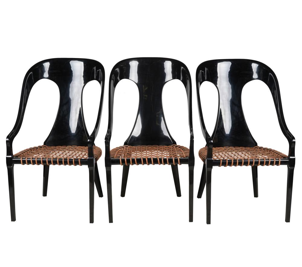 Appraisal: THREE BLACK-LACQUERED ARMCHAIRSCondition no seats each with a few minor