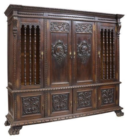 Appraisal: Spanish Renaissance Revival carved oak bookcase early th c having