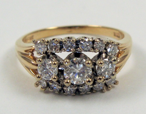 Appraisal: DIAMOND AND FOURTEEN KARAT GOLD RING set with round-cut diamonds