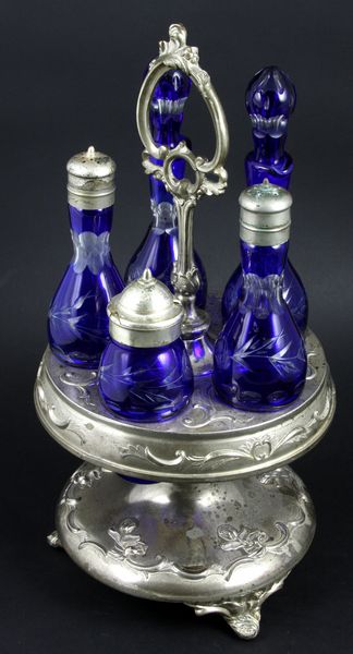 Appraisal: th Century silverplate condiment holder with matched set of overlay