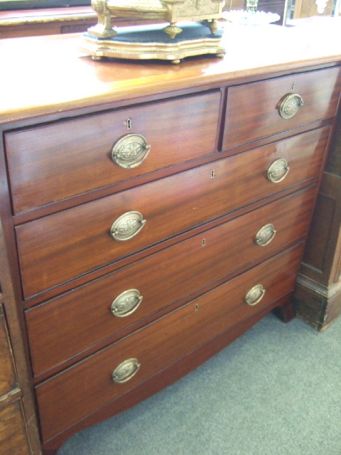 Appraisal: An early th century mahogany chest of two short and