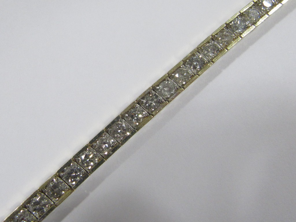 Appraisal: Fourteen carat gold diamond line bracelet with brilliant cut diamonds